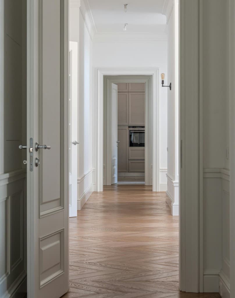 Engineered oak herringbone flooring installation in London hallway interior