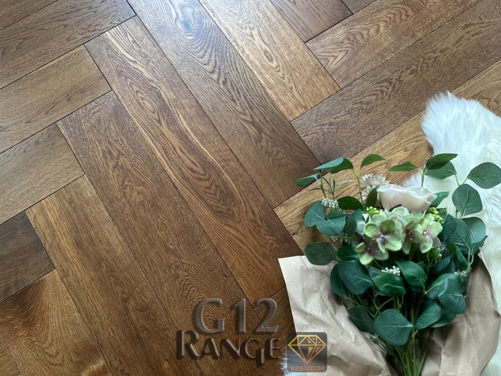Premium oak flooring installation detail in herringbone pattern