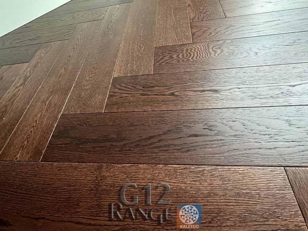 Caramel Dark Oak herringbone flooring - gallery image 1